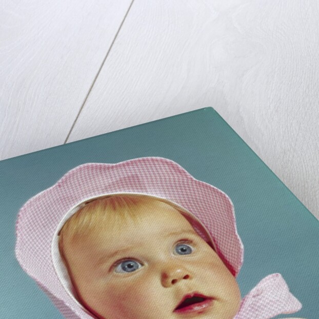 1960s Very Cute Blond Blue Eyed Baby Wearing Red White Checked Bonnet Tied In Bow At Chin by Anonymous