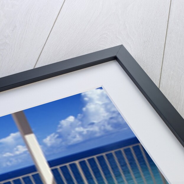 1990s Woman Wearing Black And Gold Bathing Suit Sunbathing On Patio In Deck Chair by Anonymous