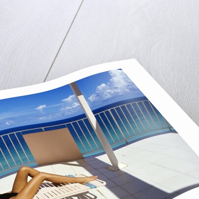 1990s Woman Wearing Black And Gold Bathing Suit Sunbathing On Patio In Deck Chair by Anonymous