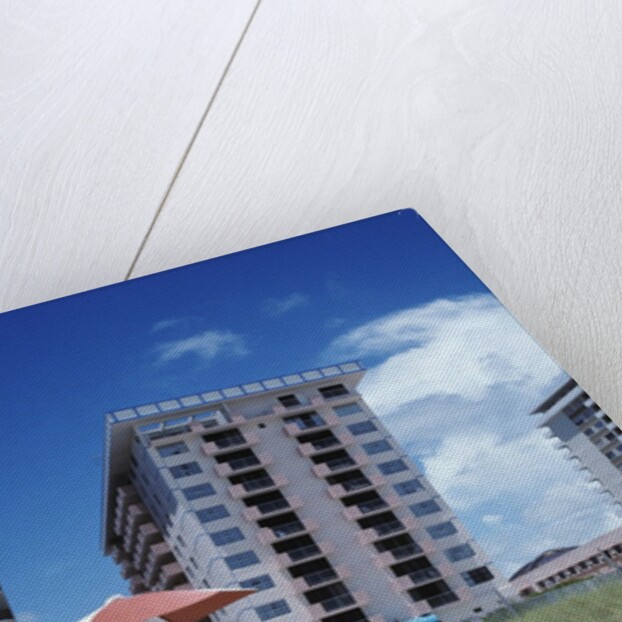 1990s Young Family On Beach Playing In The Sand by Anonymous