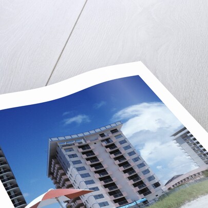 1990s Young Family On Beach Playing In The Sand by Anonymous