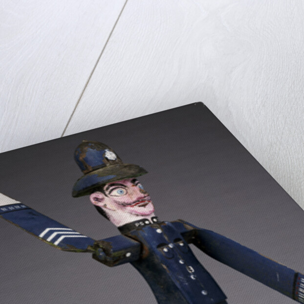 A polychrome wood and metal whirligig modelled as a police sergeant by Anonymous