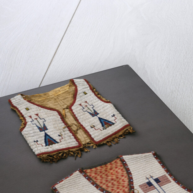 A Plains beaded hide child's vest and a Sioux pictorial beaded vest by Anonymous