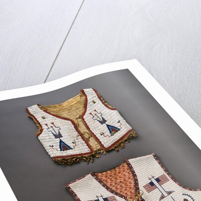 A Plains beaded hide child's vest and a Sioux pictorial beaded vest by Anonymous