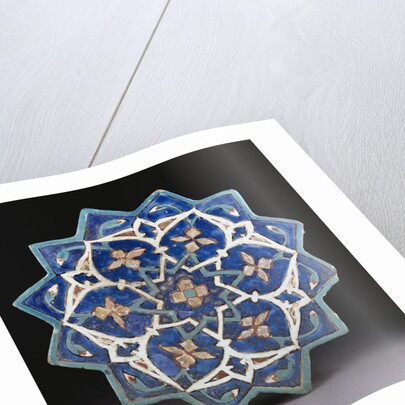 A Samarkand cuerda Seca stellar tile of twelve pointed form, the blue ground with a central turquoise and gold flower outlined in red by Anonymous