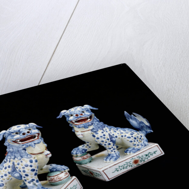 A pair of Kakiemon models of seated Karashishi by Anonymous