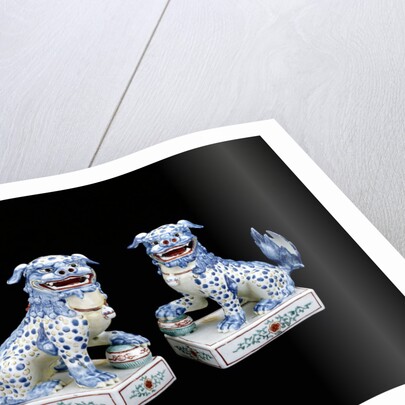 A pair of Kakiemon models of seated Karashishi by Anonymous