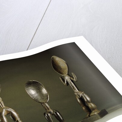 Three Dan spoons with elogated legs by Anonymous