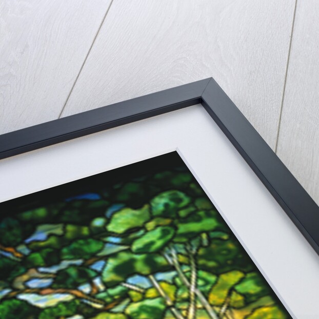Tiffany Studios landscape window depicting a meandering stream shaded by towering fir trees by Anonymous