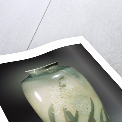 An earthenware vase depicting hyacinths and leafage in shades of ivory and green by Anonymous