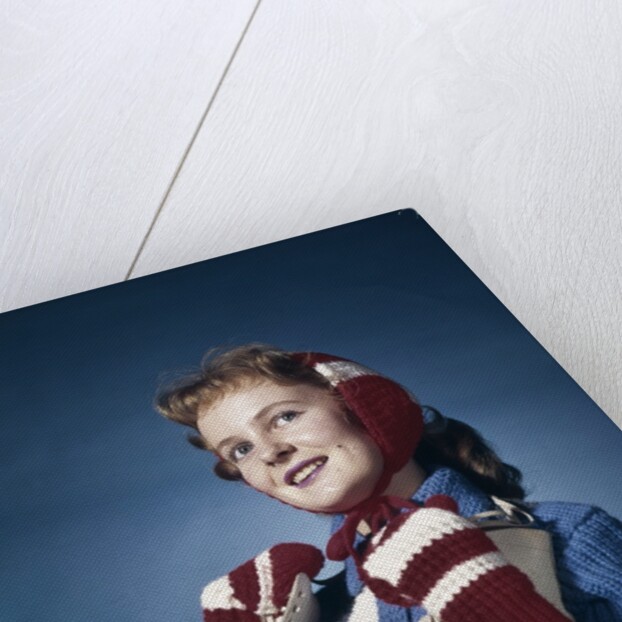 1960s Smiling Woman Wearing Red Mittens Ear Muff Blue Sweater Holding Ice Skates by Anonymous