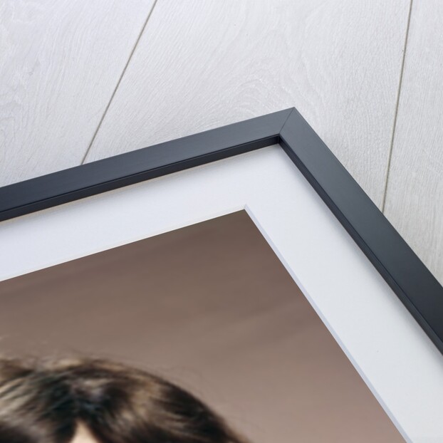 1960s Brunette Woman Holding Blank Business Card To Face Looking At Camera Wearing Yellow Top by Anonymous