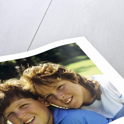 1980s Two Brothers And Their Sister Posed Heads Together Smiling Looking At Camera by Anonymous