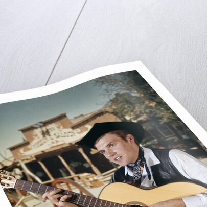 1960s Man Singing Cowboy Strumming Playing Acoustic Guitar by Anonymous