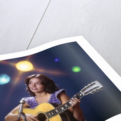1970s Woman Girl Performer Playing Guitar Singing Microphone Stage Lights by Anonymous