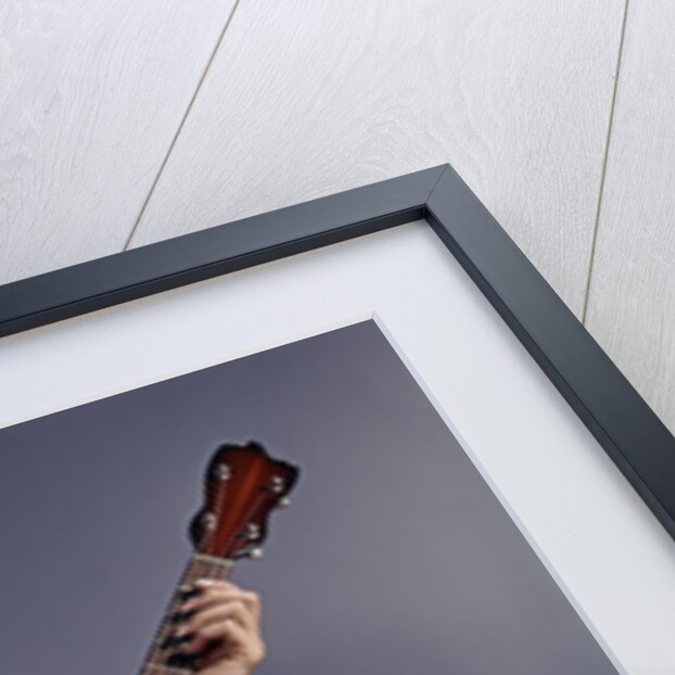 1960s Young Blonde Woman Wearing Plaid Shirt Playing Banjo Singing Folk Music Looking At Camera by Anonymous