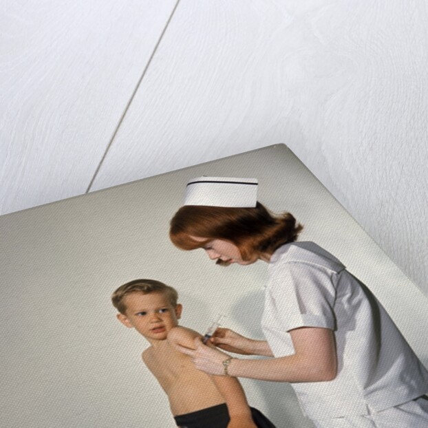 1960s Woman Nurse Give Injection Needle To Little Boy Arm Vaccine Vaccination Prevention Immunize Inoculate Medicine by Anonymous
