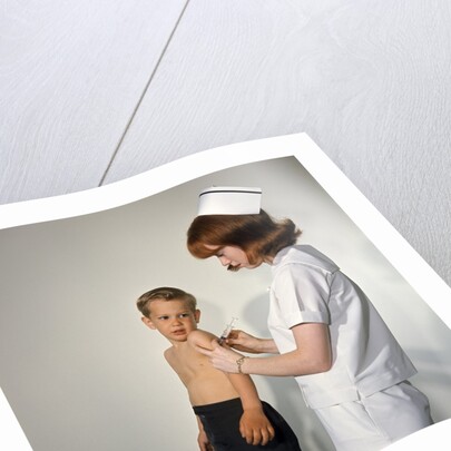 1960s Woman Nurse Give Injection Needle To Little Boy Arm Vaccine Vaccination Prevention Immunize Inoculate Medicine by Anonymous