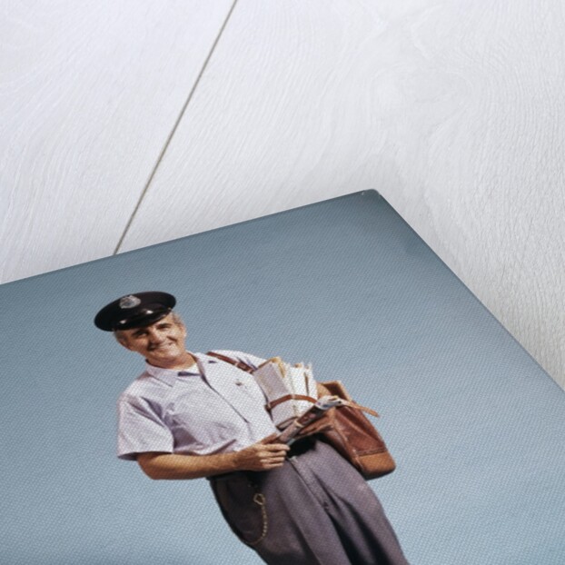 1970s Standing Full Length Portrait Of Middle Aged Mailman Carrying Mail Bag Wearing Uniform by Anonymous