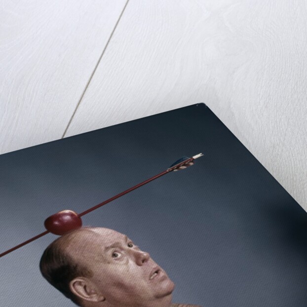1960s Anxious Nervous Man Looking Up At Arrow Shot Through An Apple Sitting On Top Of His Head by Anonymous
