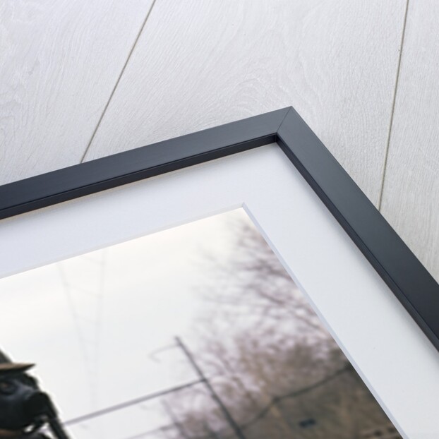 1950s Man Wearing Gas Mask Hat At Commuter Train Station Holding Briefcase Newspaper by Anonymous