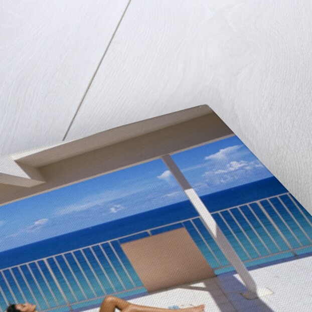 1990s Man And Woman On Sunny Deck Balcony Overlooking The Ocean by Anonymous