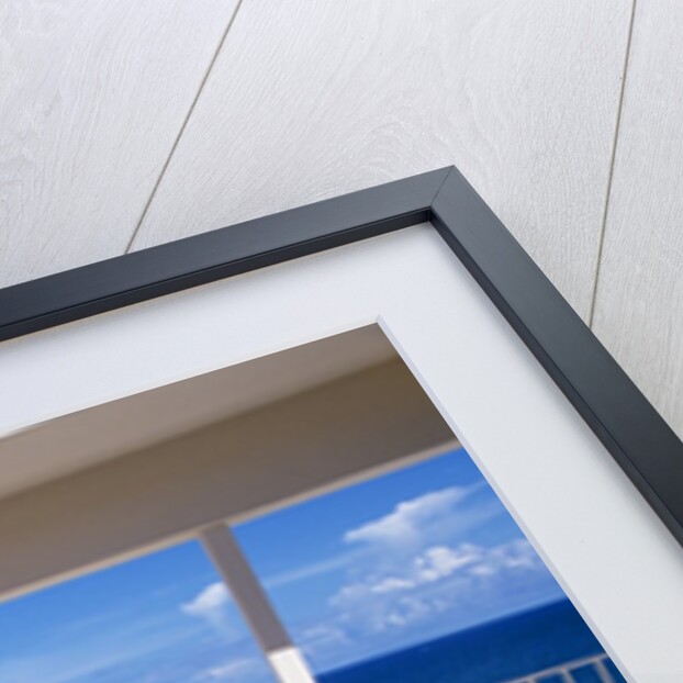 1990s Man And Woman On Sunny Deck Balcony Overlooking The Ocean by Anonymous
