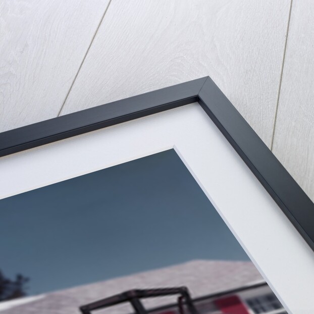 1950s Woman Hiding Behind Sled Throwing Snowball Front Stone House by Anonymous