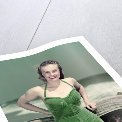 1940s Portrait Smiling Woman Wearing Green Velvet Bathing Suit Posing Leaning On Diving Board by Anonymous