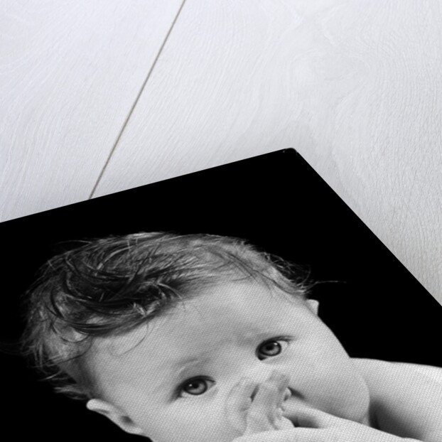 1940s Cute Baby Sucking Thumb Looking At Camera by Anonymous