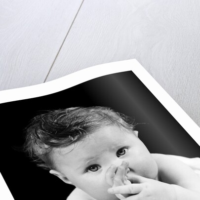 1940s Cute Baby Sucking Thumb Looking At Camera by Anonymous