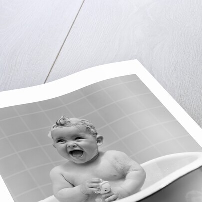1940s Smiling Baby In Bath Covered In Soap Suds Laughing Holding Toy by Anonymous