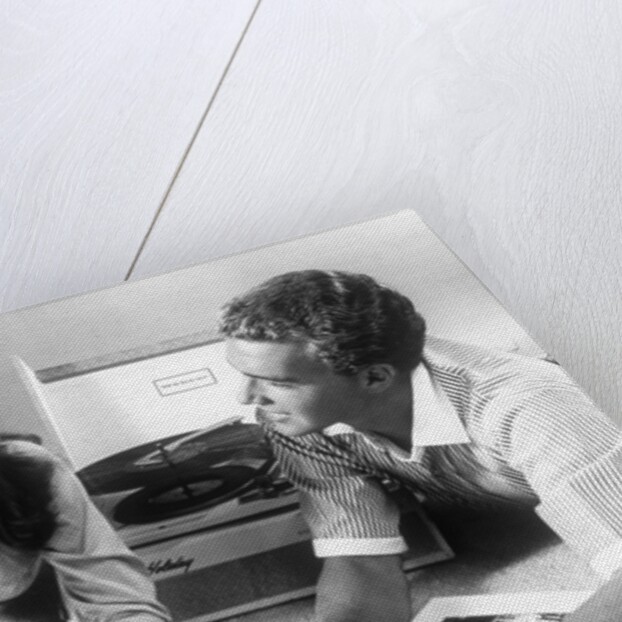 1960s Teen Couple Playing Lp Vinyl Records On Portable Phonograph by Anonymous