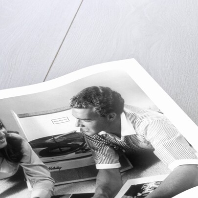 1960s Teen Couple Playing Lp Vinyl Records On Portable Phonograph by Anonymous