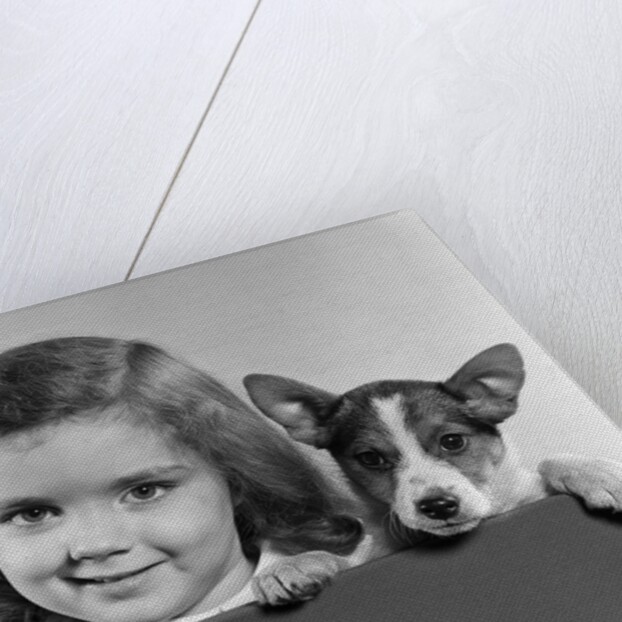 1940s 1950s Portrait Of Little Girl With Small Dog Looking At Camera by Anonymous