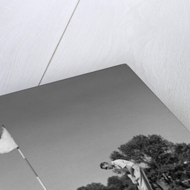 1950s Man Playing Golf Putting Golf Ball On Green To Flag And Cup Outdoor by Anonymous