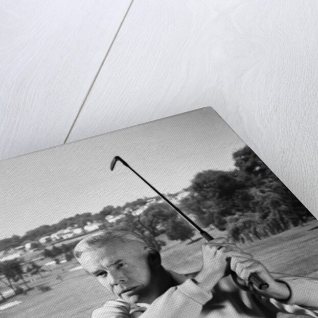 1960s Man Playing Golf Hitting Golf Ball From Fairway With Iron Club by Anonymous