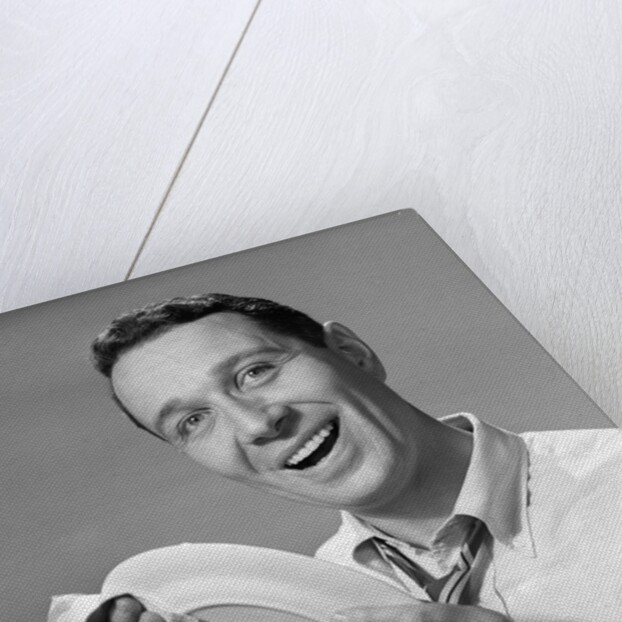 1950s Smiling Man Drying Plate With Dish Towel Looking At Camera by Anonymous