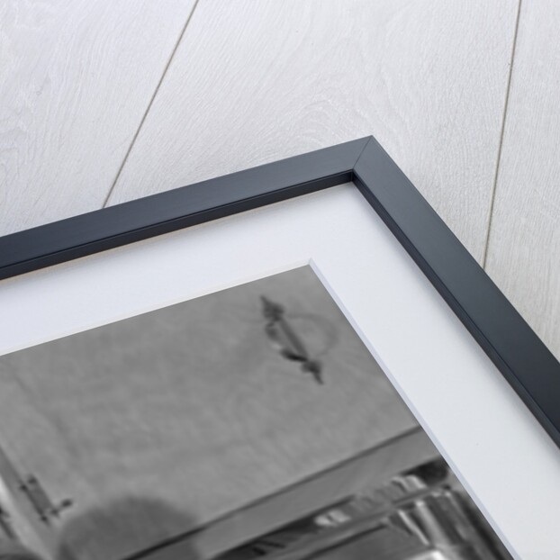 1950s Smiling Woman Housewife Wearing Apron Taking Large Roast Beef From Electric Oven In Kitchen Looking At Camera by Anonymous