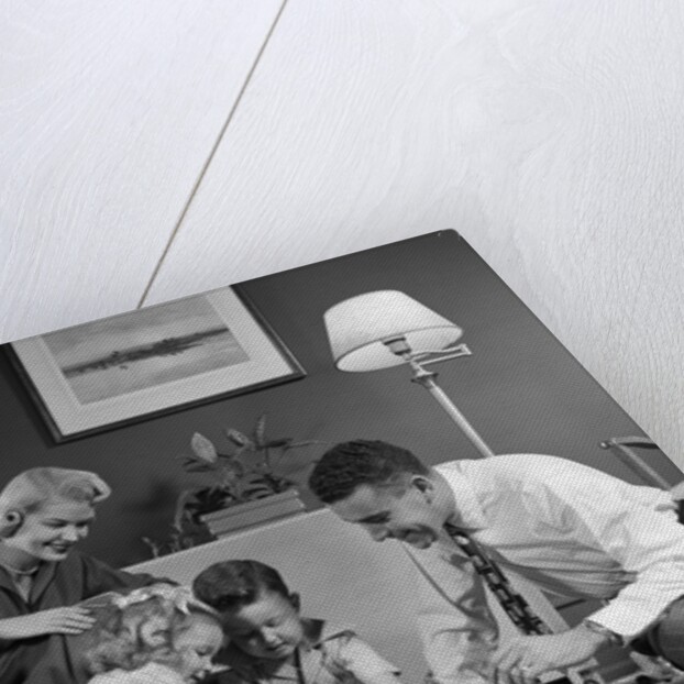 1950s Family Of 4 Gathered In Living Room Playing With Letter Blocks by Anonymous