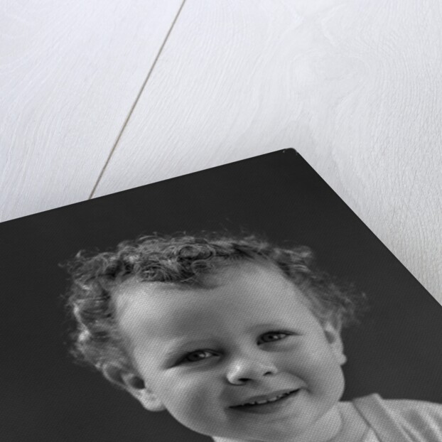 1940s Curly Haired Little Boy Portrait Smiling Looking At Camera by Anonymous