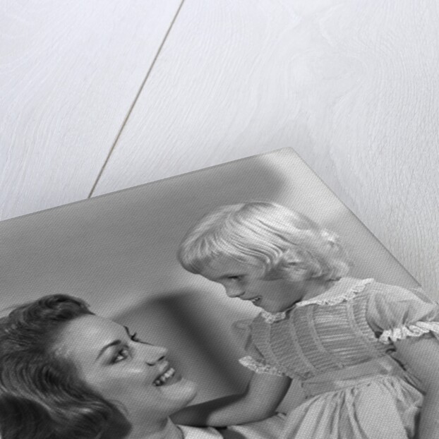 1960s Mother Holding Little Blond Girl Wearing Fancy Dress In Her Arms Looking At Each Other by Anonymous