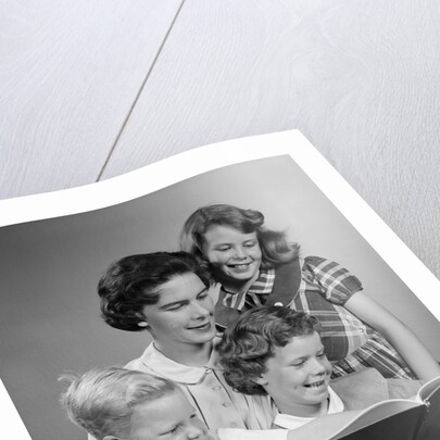 1950s Portrait Mother Two Daughters And Son Reading Book Together by Anonymous