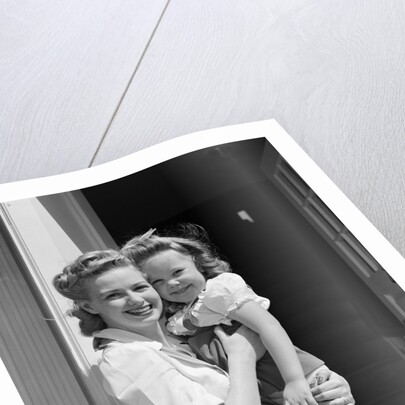 1940s Portrait Woman Mother Holding Girl Daughter Smiling Looking At Camera by Anonymous