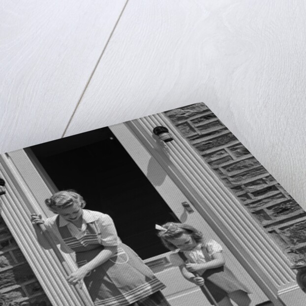 1940s Mother And Daughter Sweeping Sidewalk In Front Of Home by Anonymous