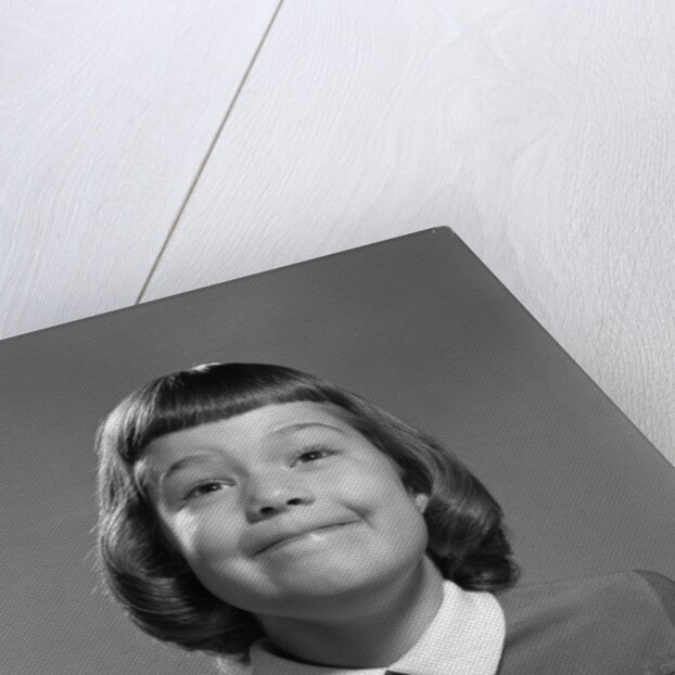 1950s Girl Page Boy Hair Bangs Smiling Funny Facial Expression Looking At Camera by Anonymous