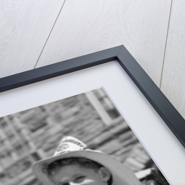 1930s Smiling Boy Standing Next To Fire Engine Wearing Firemans Hat by Anonymous