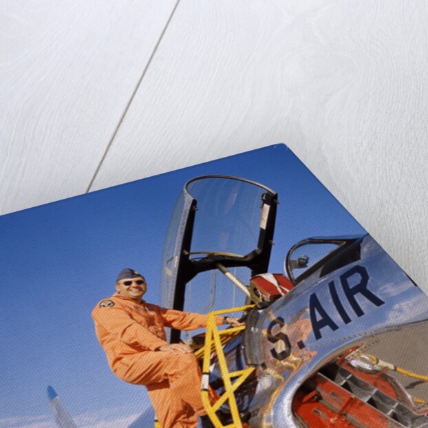 1960s 1970s Smiling Military Pilot Ladder Climbing Enter Cockpit Looking At Camera by Anonymous