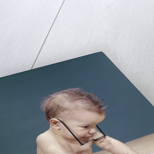 1960s Funny Baby Wearing Oversized Glasses Reading Big Book by Anonymous