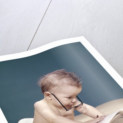 1960s Funny Baby Wearing Oversized Glasses Reading Big Book by Anonymous